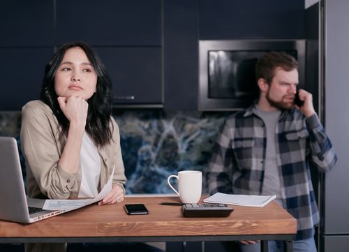 Free A couple in their kitchen, focused on financial planning and budgeting, showcasing stress and teamwork. Stock Photo