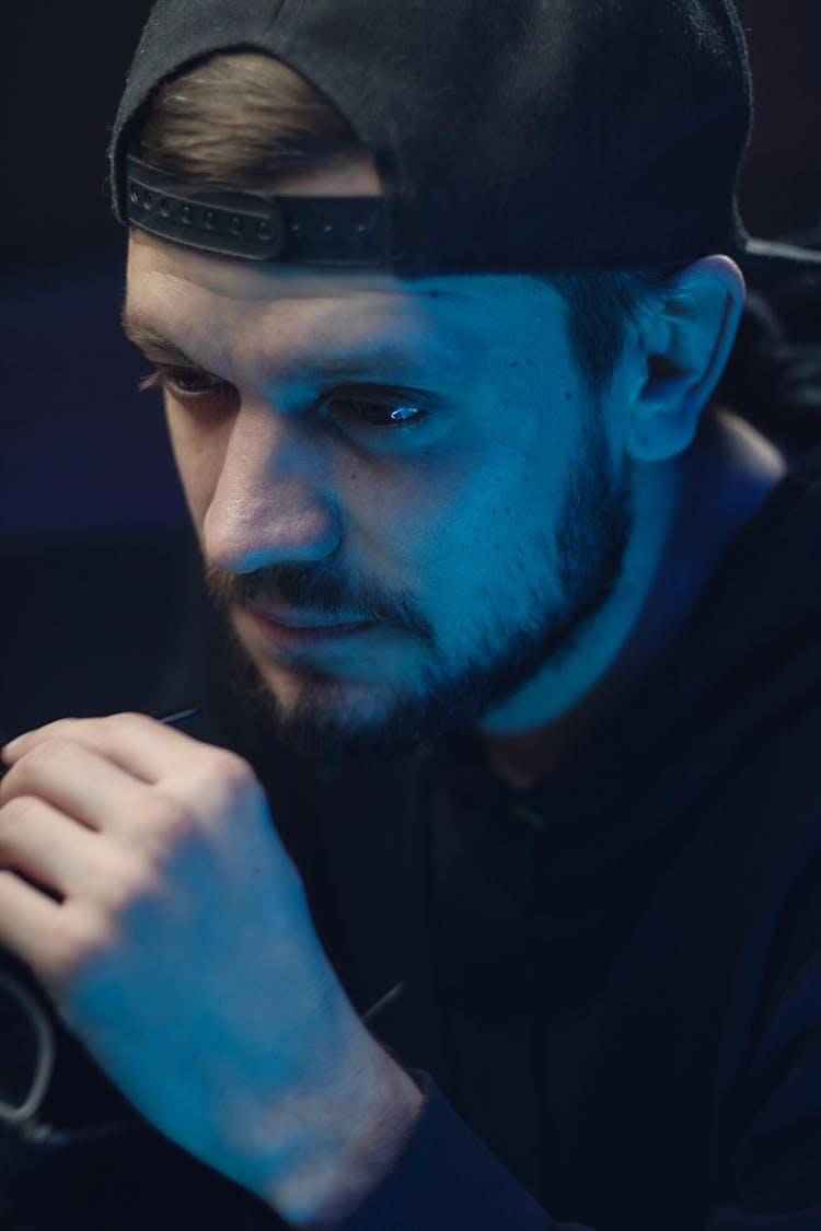 Close Up Photo Of Bearded Man Wearing Black Snapback Cap