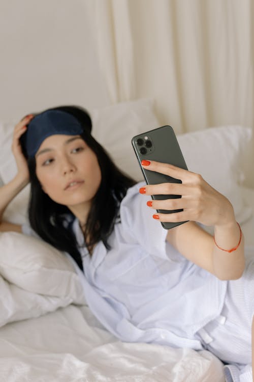 Free Woman in White Pajama Taking Selfie Stock Photo