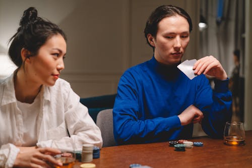 Man and Woman Playing Poker