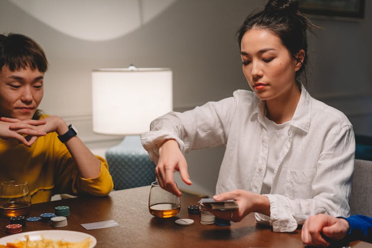 A Woman And Man Gambling Together 