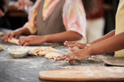 Hands of Girls Making a Pie Dough