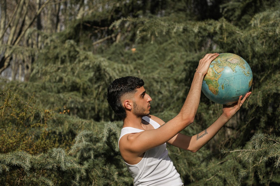 Man Holding a Globe