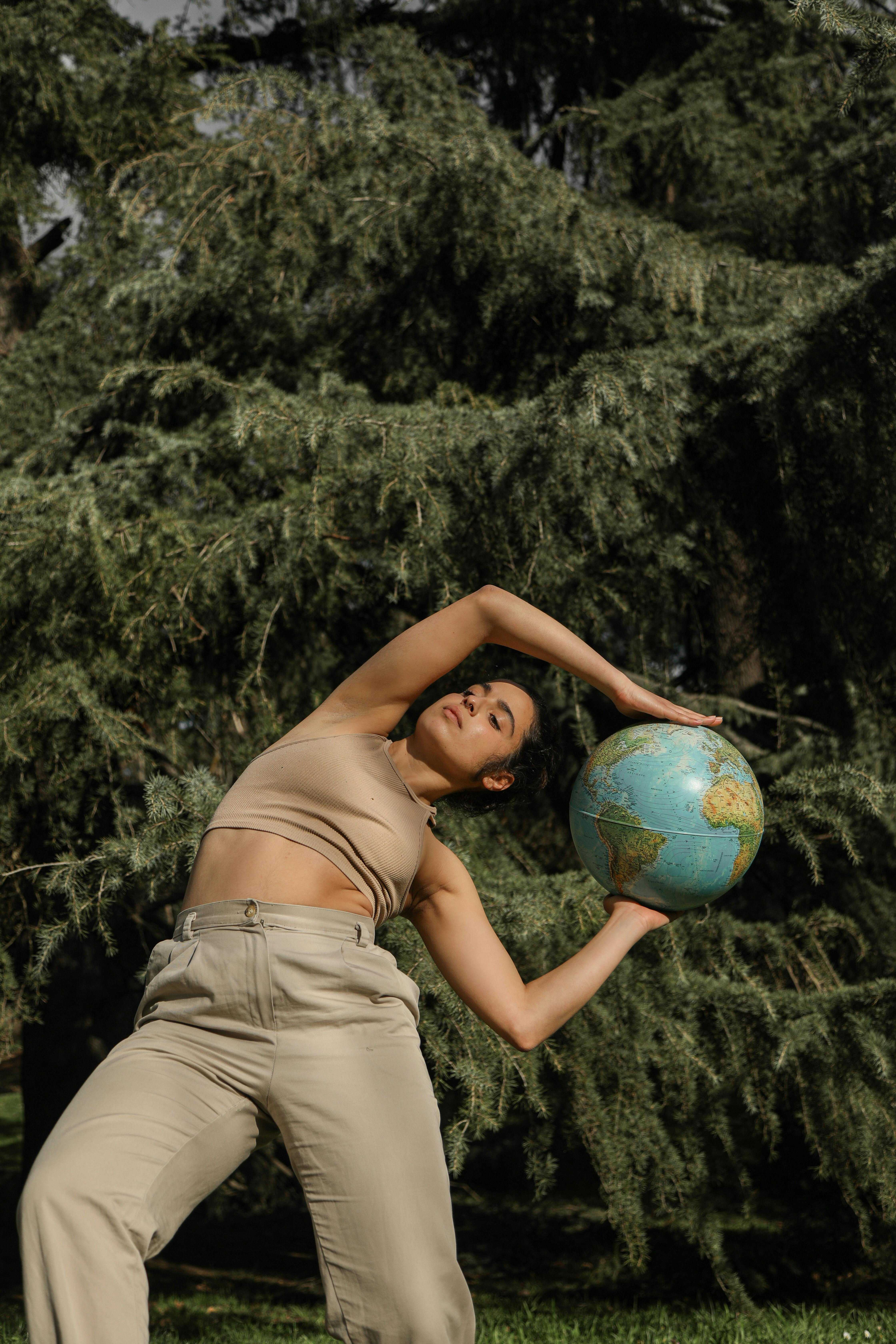 woman holding a globe