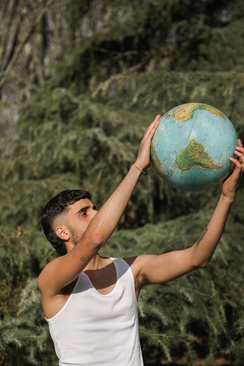 Man Holding A Globe