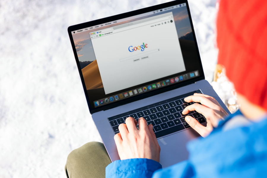 contractor reviewing roofing website seo and content strategy on laptop