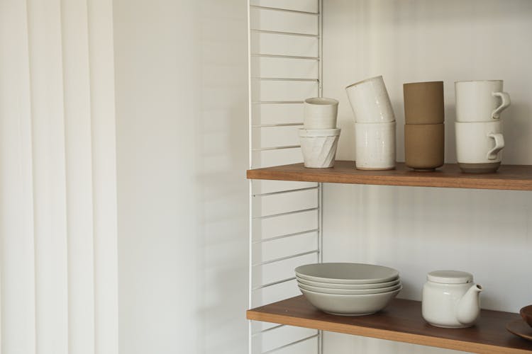 Shelves With Ceramic Cups And Plates