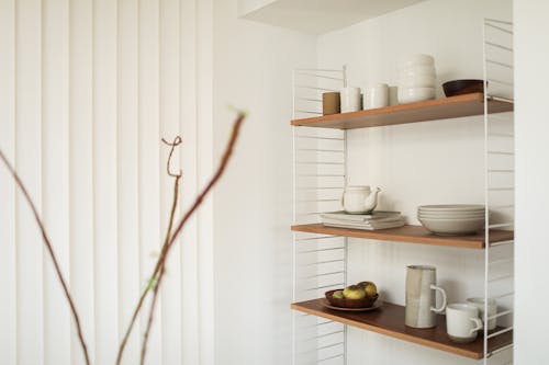 Tableware on Wooden Shelves Mounted on Wall