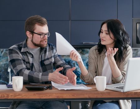 Man and Woman Sitting at Table