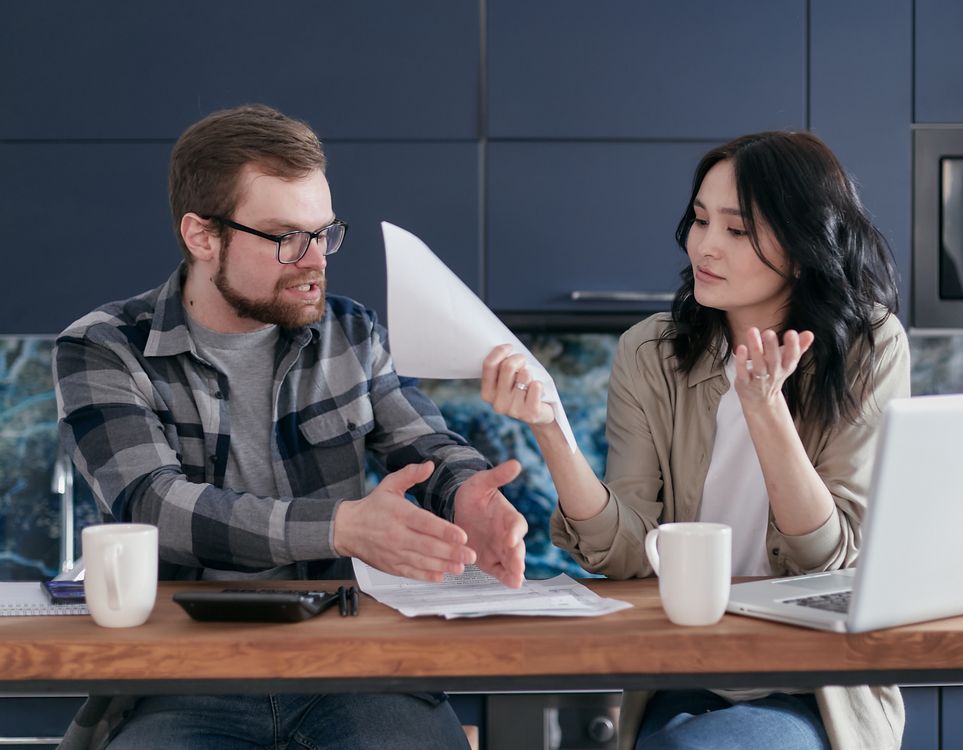 Man and Woman Sitting at Table · Free Stock Photo