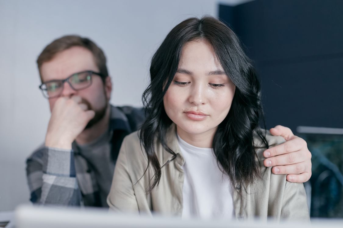 A Man Holding a Woman on her Shoulder · Free Stock Photo