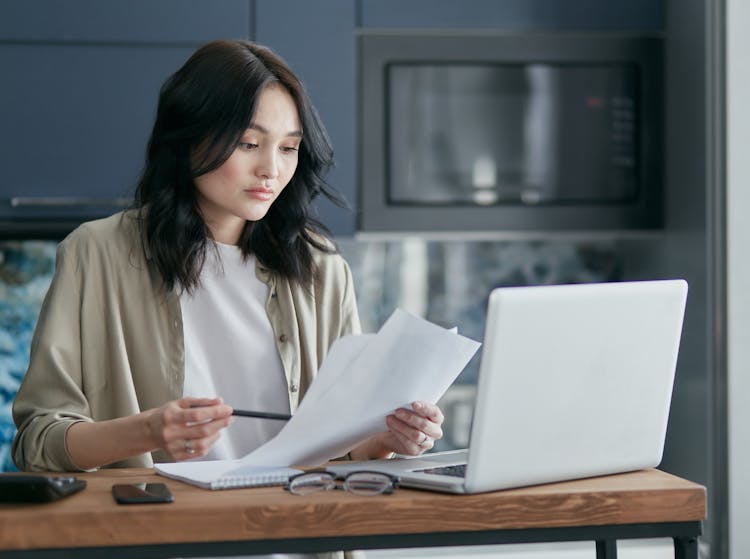 Woman Holding Papers 