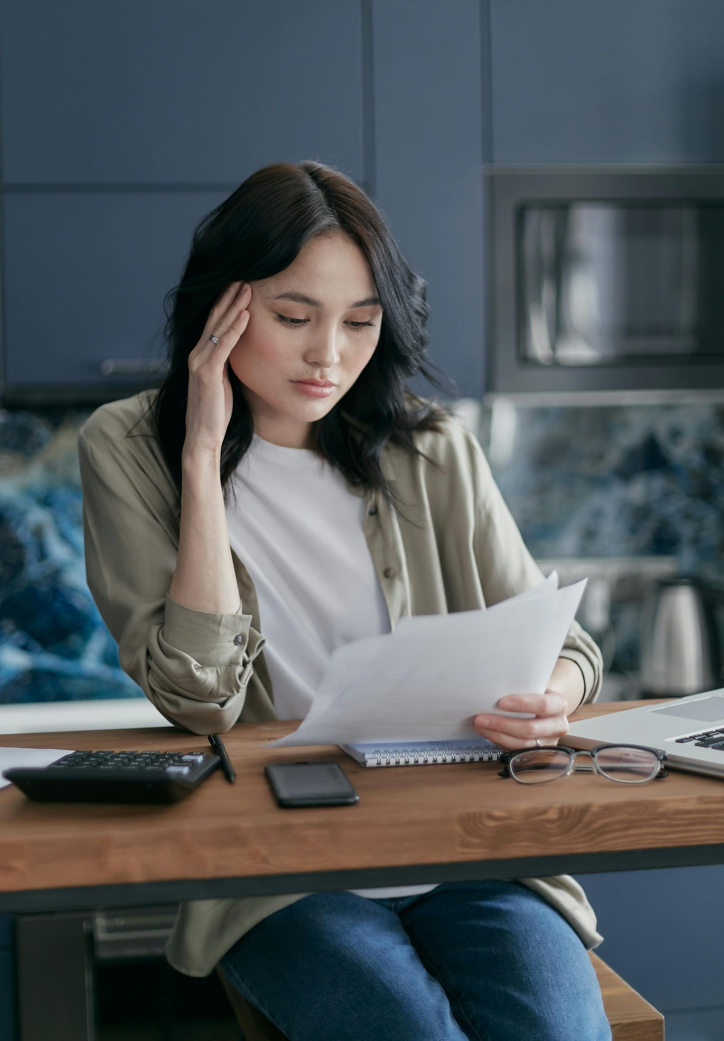 a woman reading documents