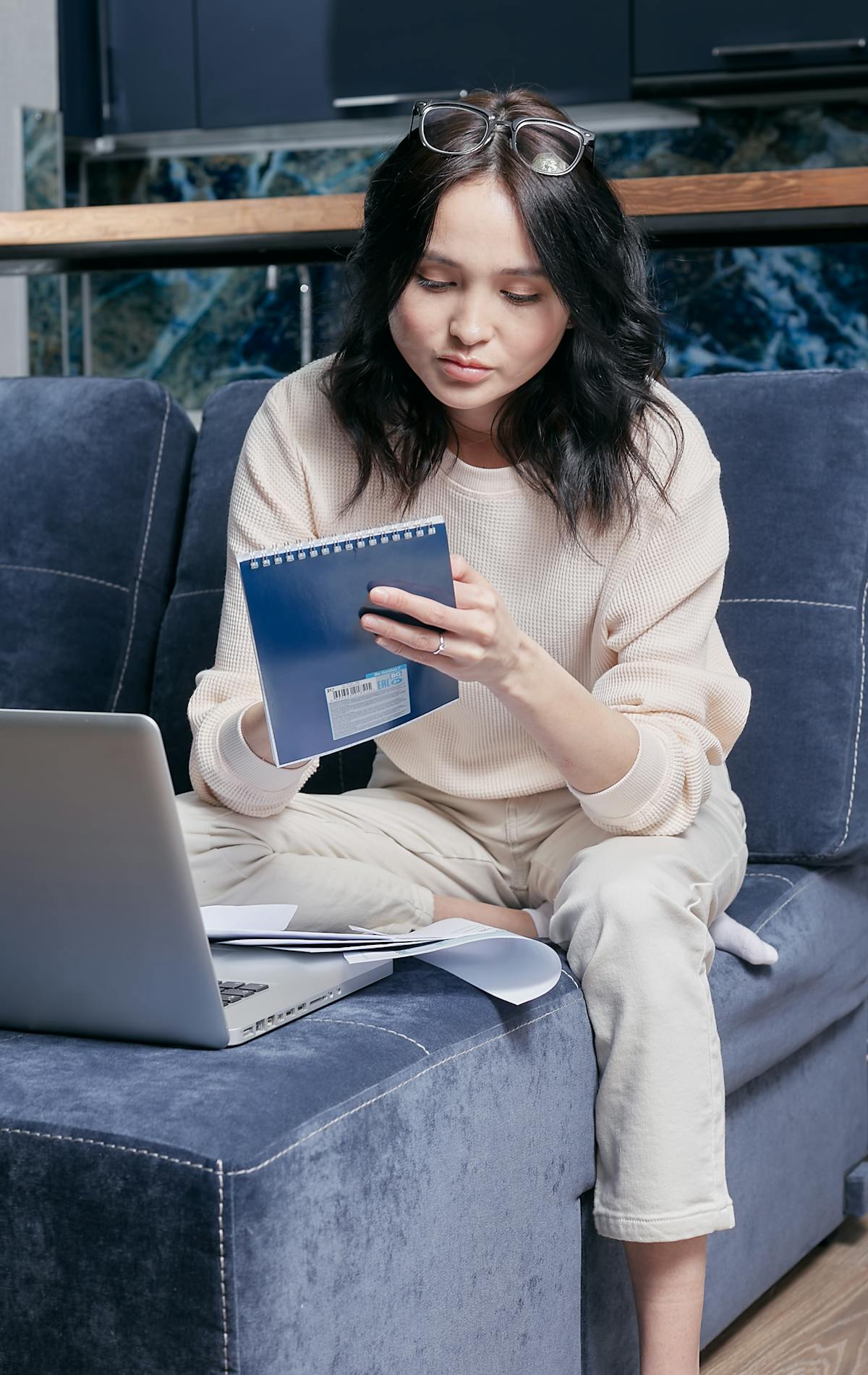 Person planning their day with a notebook and smartphone