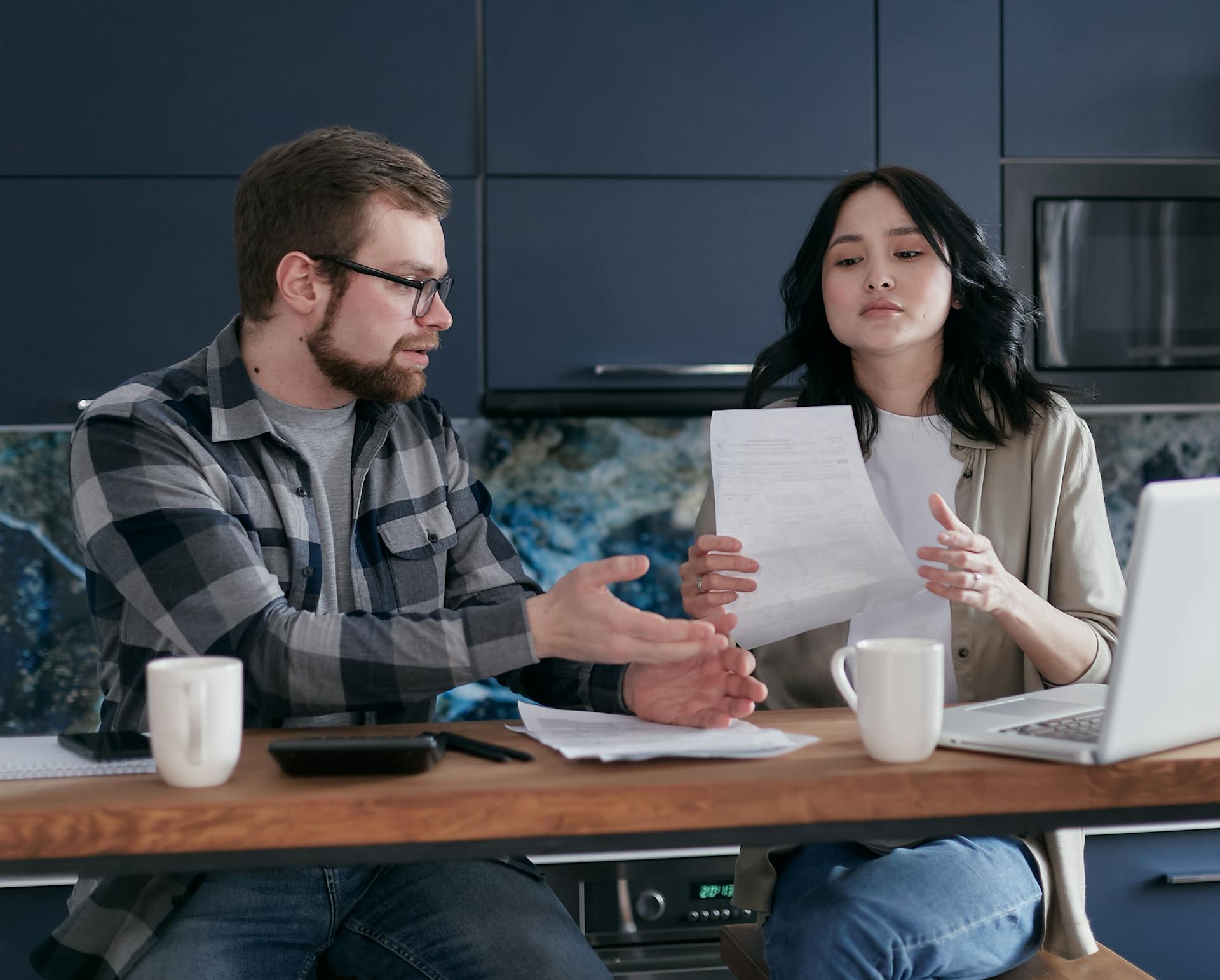 Stressed Man Explaining to  his Partner