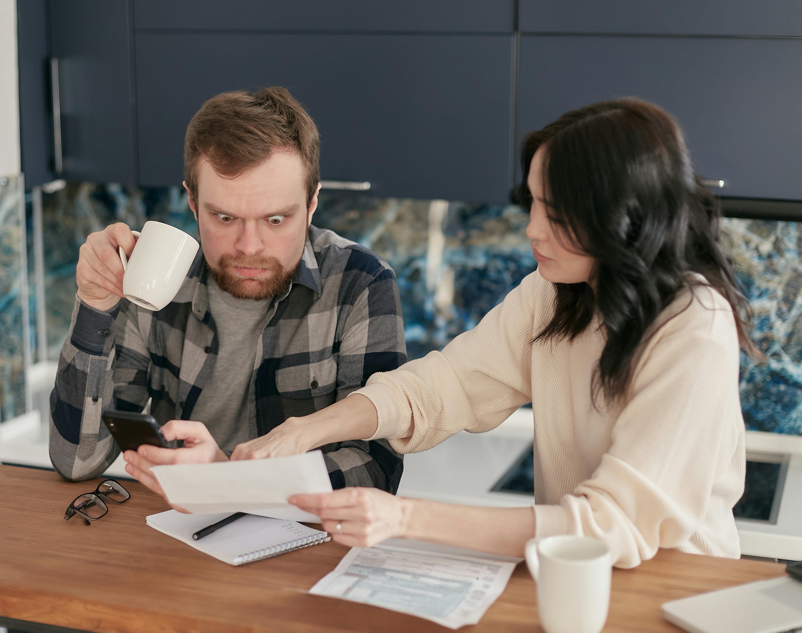 shocked man holding coffee mug