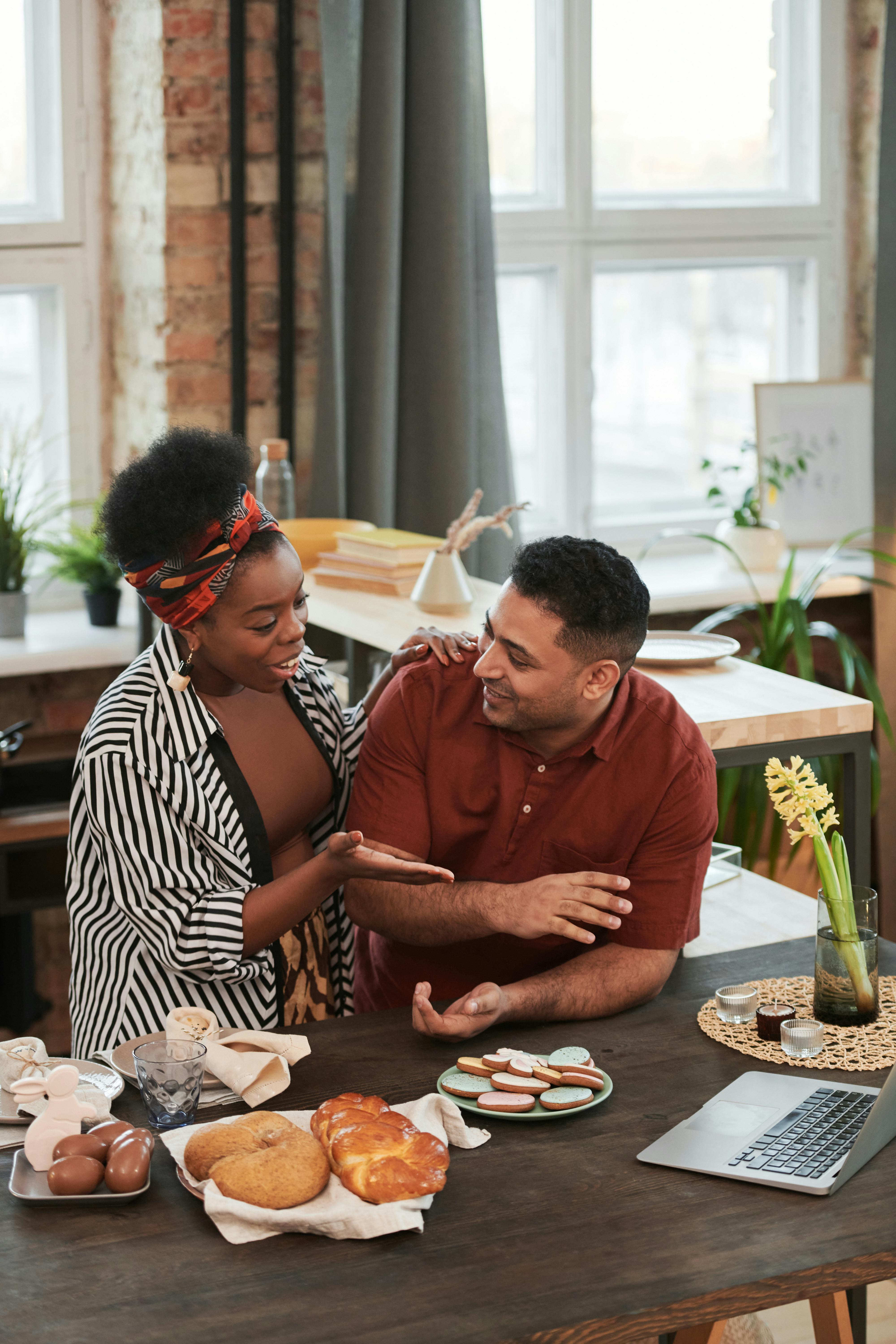 a happy couple talking while on a video call