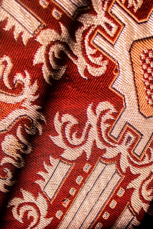 Colorful carpet with red and golden threads