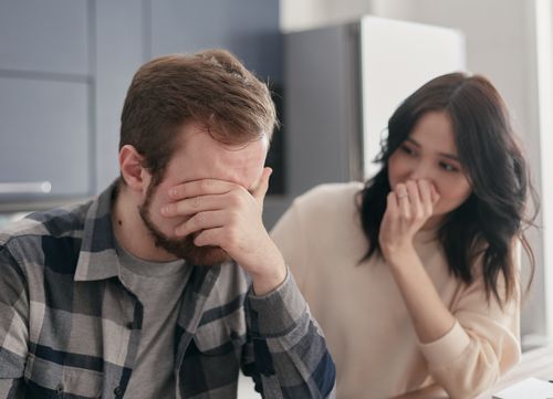 Free A distraught couple indoors, showing stress and concern, fostering empathy. Stock Photo