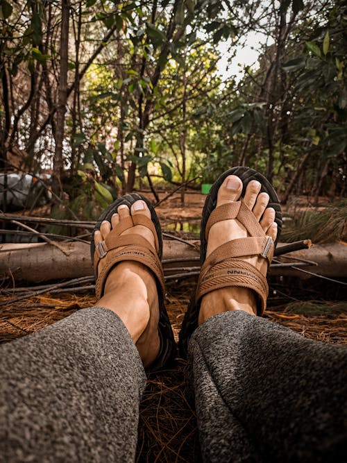 A Person Wearing Brown Sandals