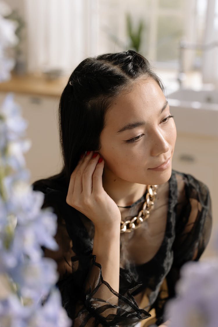 Woman Wearing Black Blouse And Gold Necklace