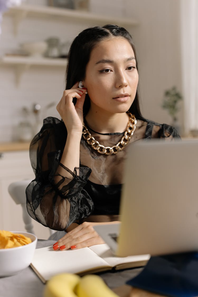 Woman Putting Air Pods 