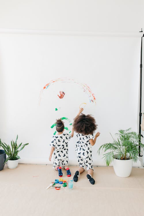 Free Kids Painting a Backdrop Stock Photo