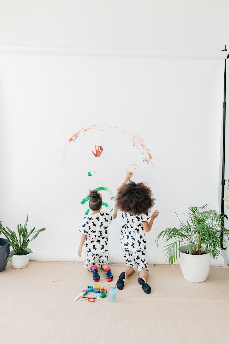 Kids Painting A Backdrop