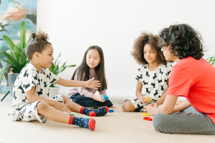 Kids Sitting On The Floor