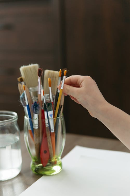 Free Assorted Paintbrushes on Glass Cup Stock Photo