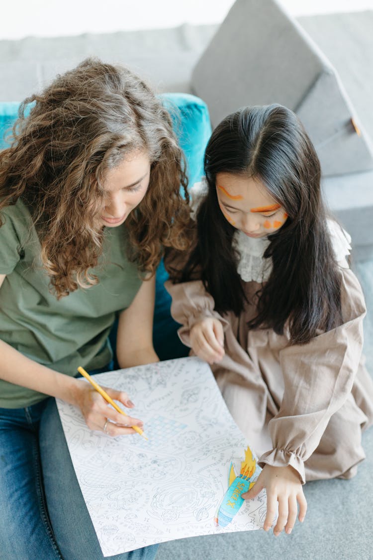 Mother And Daughter Drawing Together