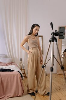 Creator setting up a tripod for a photo shoot — photo by cottonbro studio on Pexels