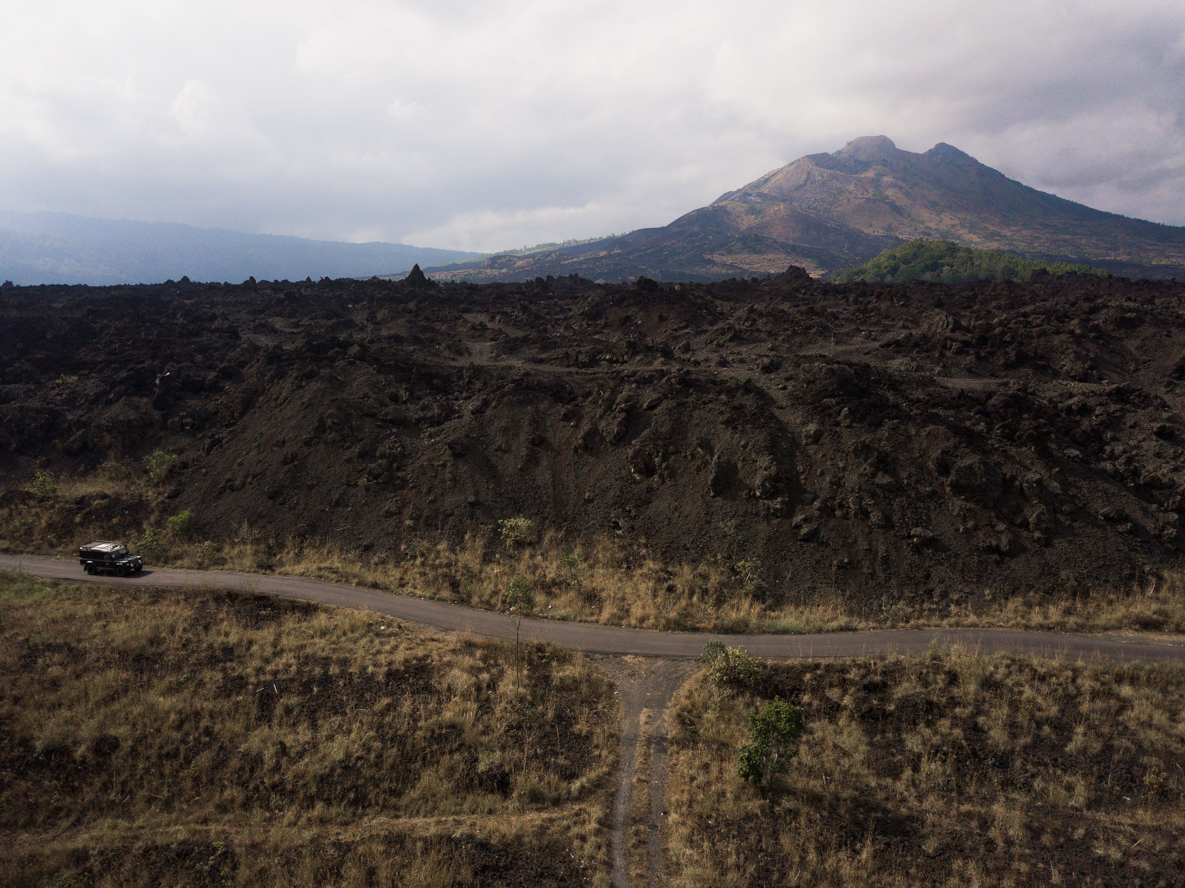 A Road on a Mountain Under Cloudy Sky · Free Stock Photo
