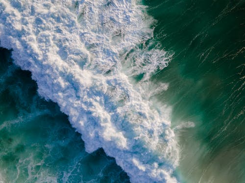 Free Drone Shot of Big Waves Crashing in the Ocean Stock Photo