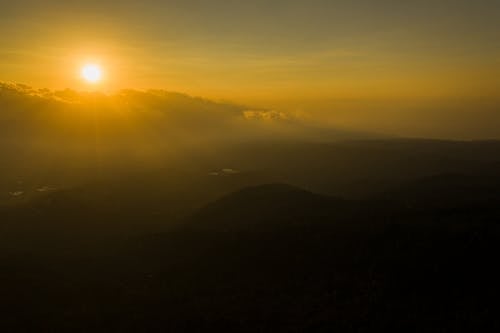 Free Sun Setting over the Mountains Stock Photo