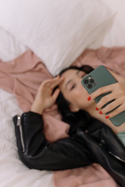Free Person Holding Iphone 6 With Teal Case Stock Photo