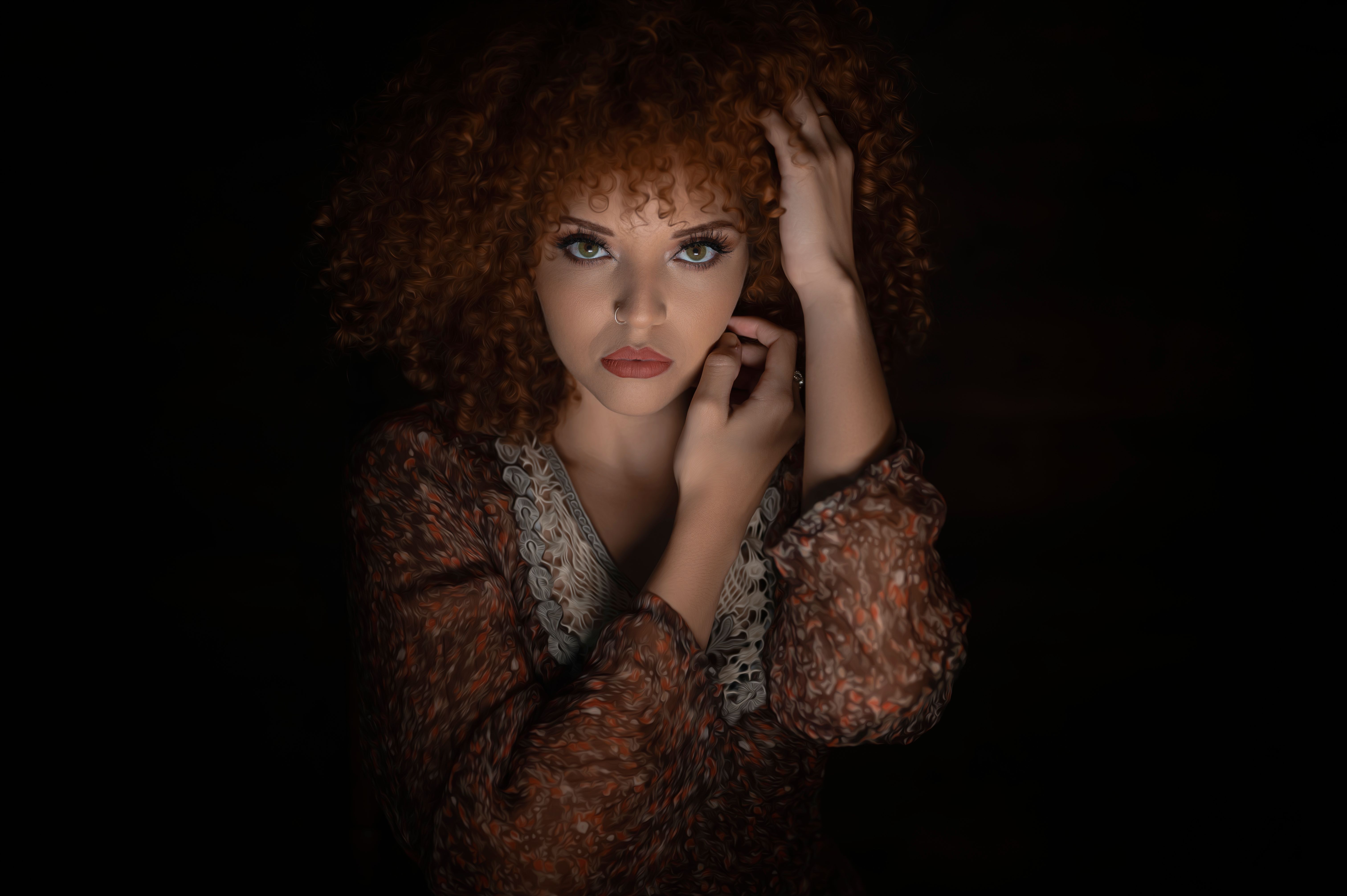 Woman with Curly Hair Seriously Looking at the Camera · Free Stock Photo