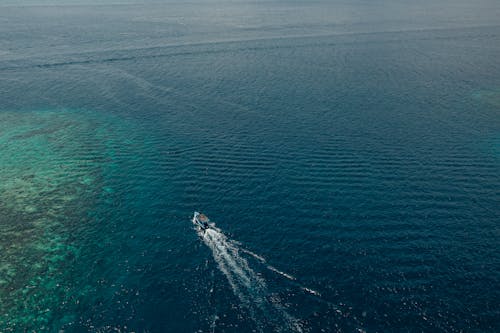Aerial Shot of a Boat Sailing on the Sea 