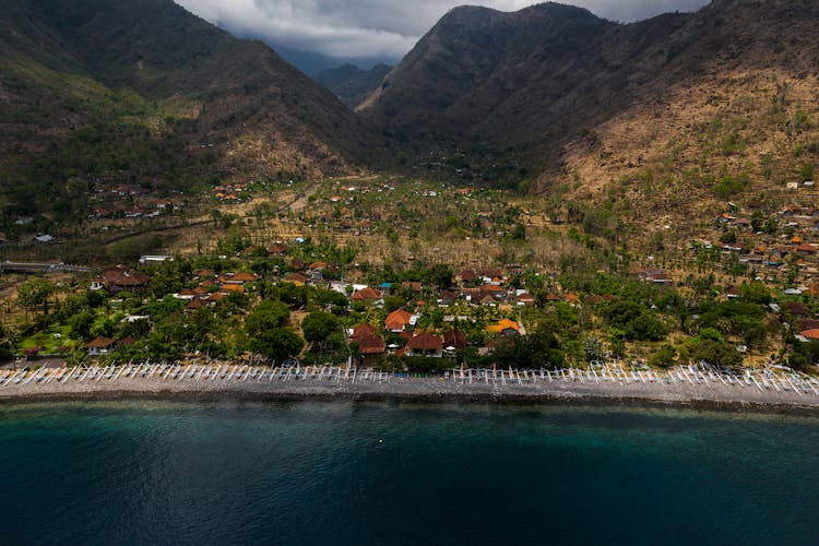 A Coastal Village Surrounded By Mountains