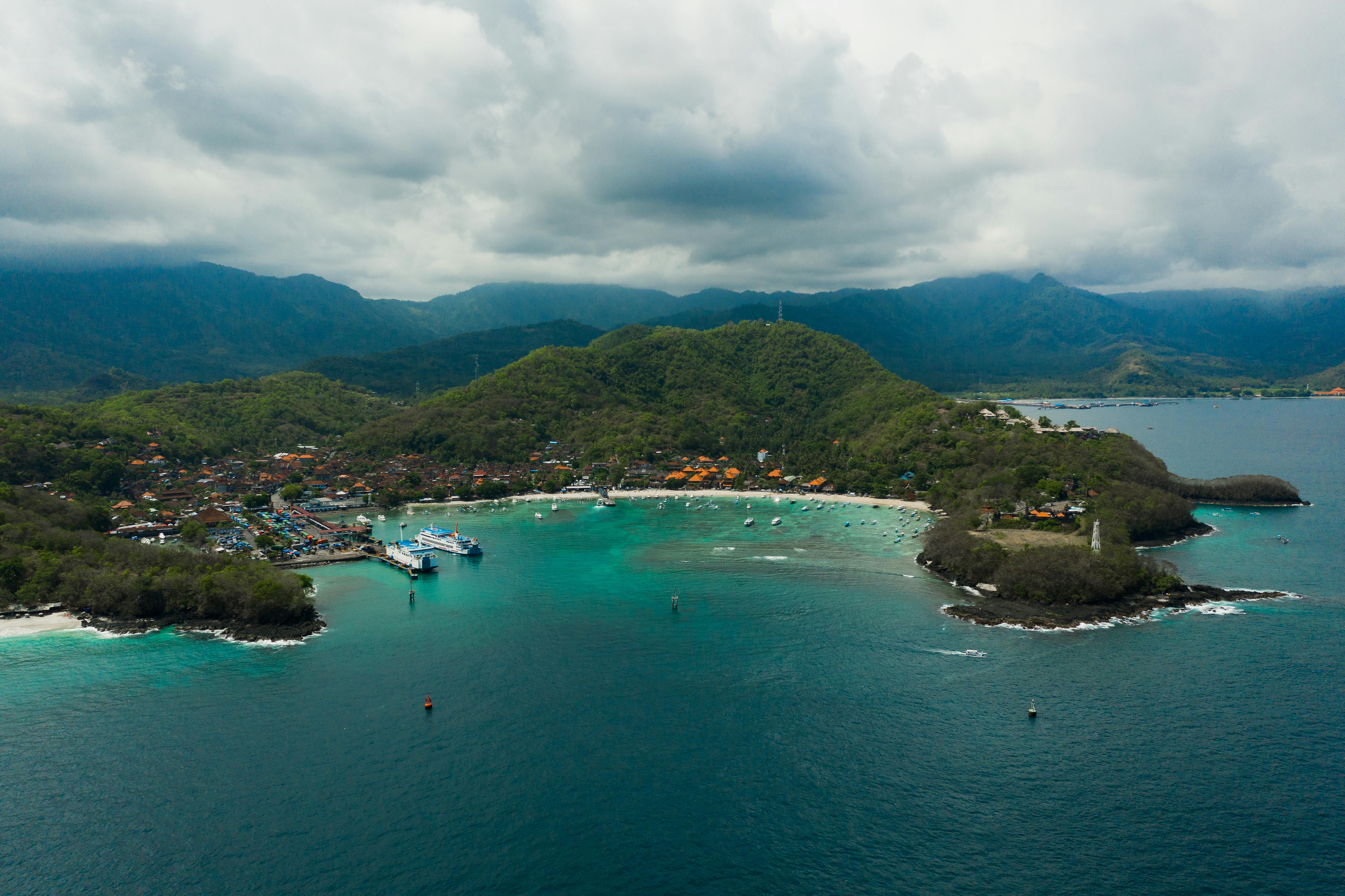 Stunning aerial view of Padang Bai Beach and coastline, showcasing Bali's vibrant landscape and turquoise sea.