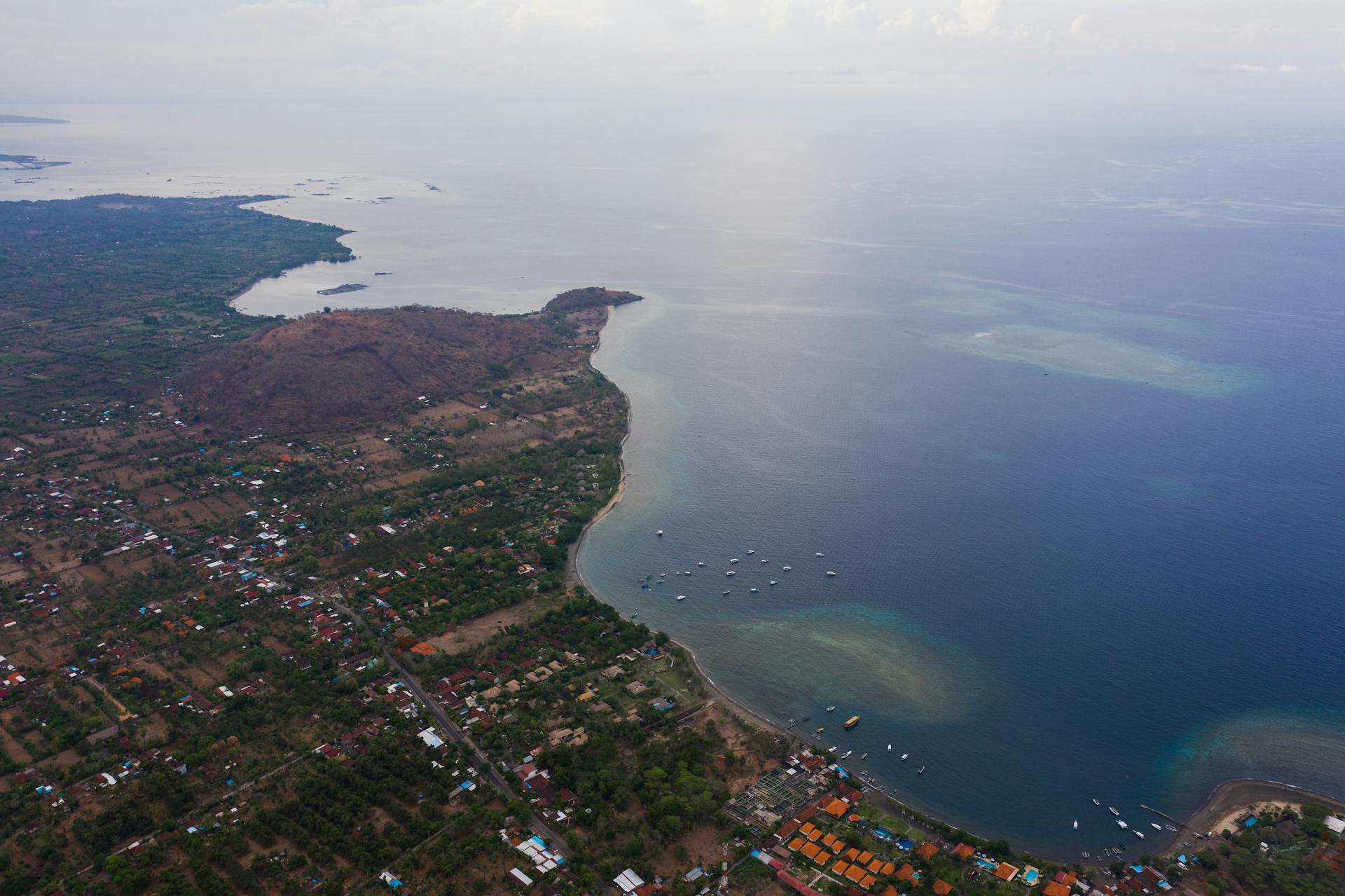 A scenic aerial view showcasing a coastal town and expansive ocean.