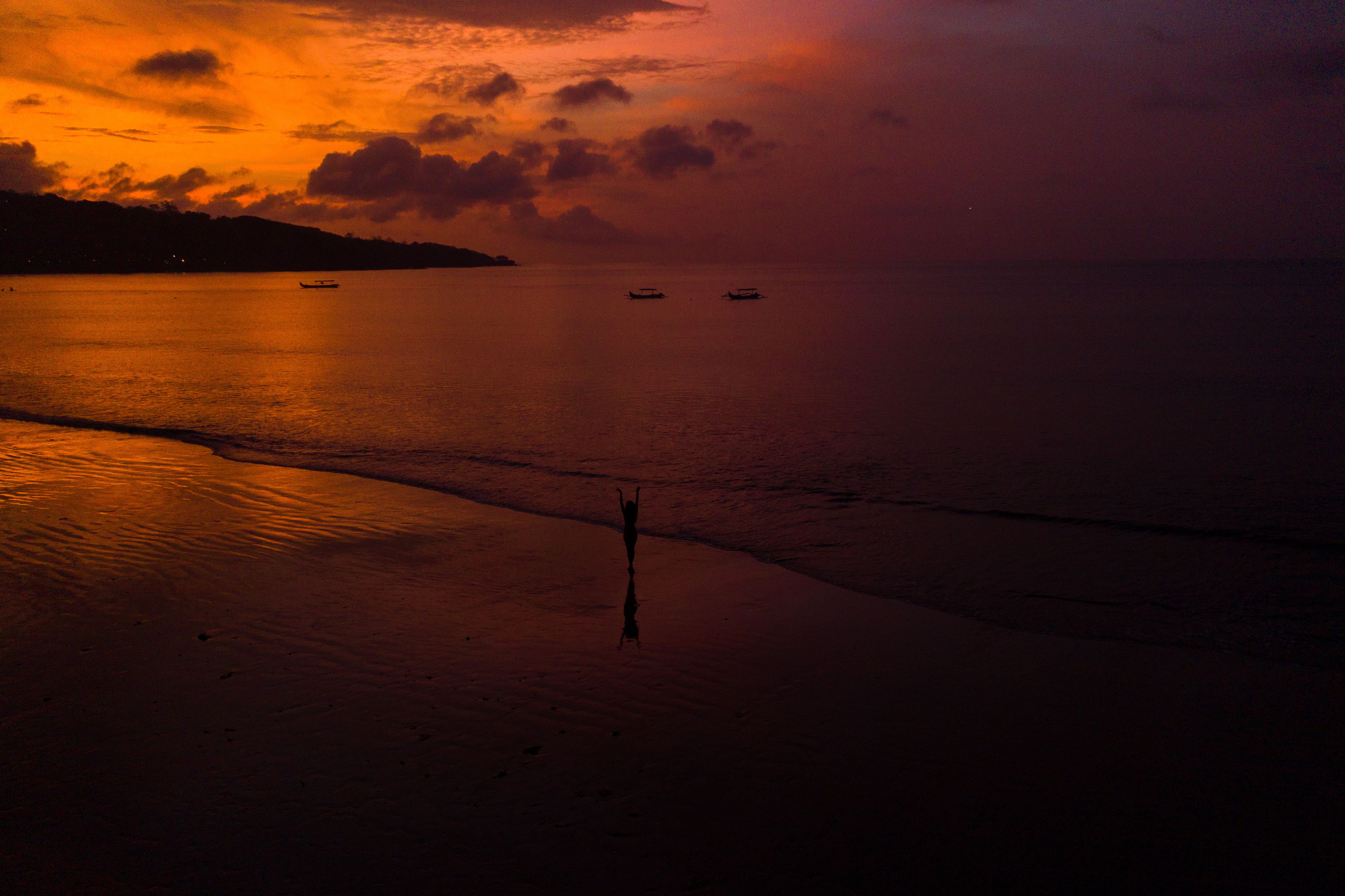 A Silhouette of a Woman on a Beach · Free Stock Photo
