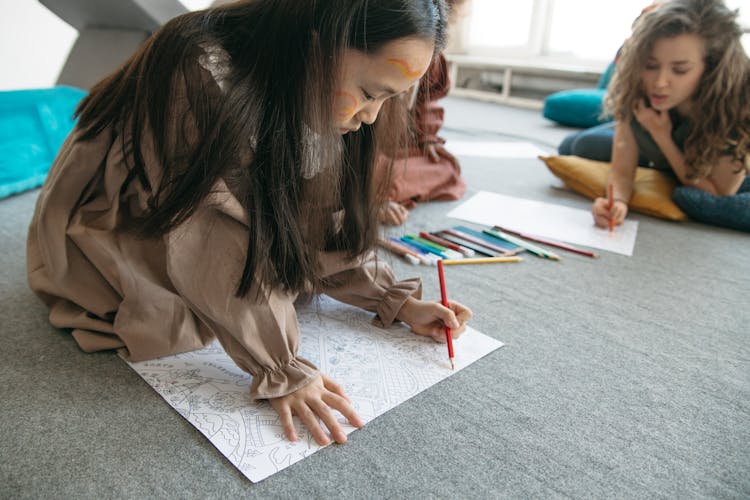 Photo Of A Girl Coloring