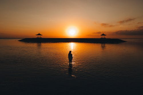 
A Woman in the Ocean during the Golden Hour