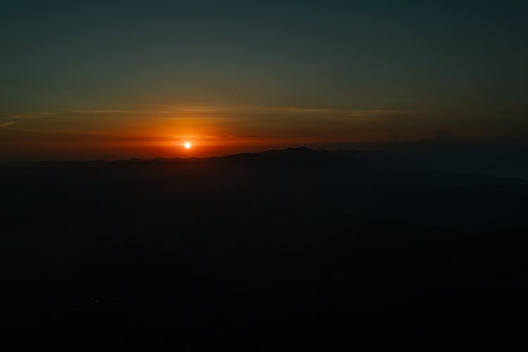 Silhouette Of Mountain During Sunset