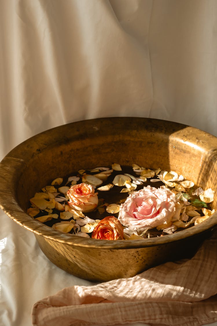 Floating Flowers And  Petals In A Wash Basin