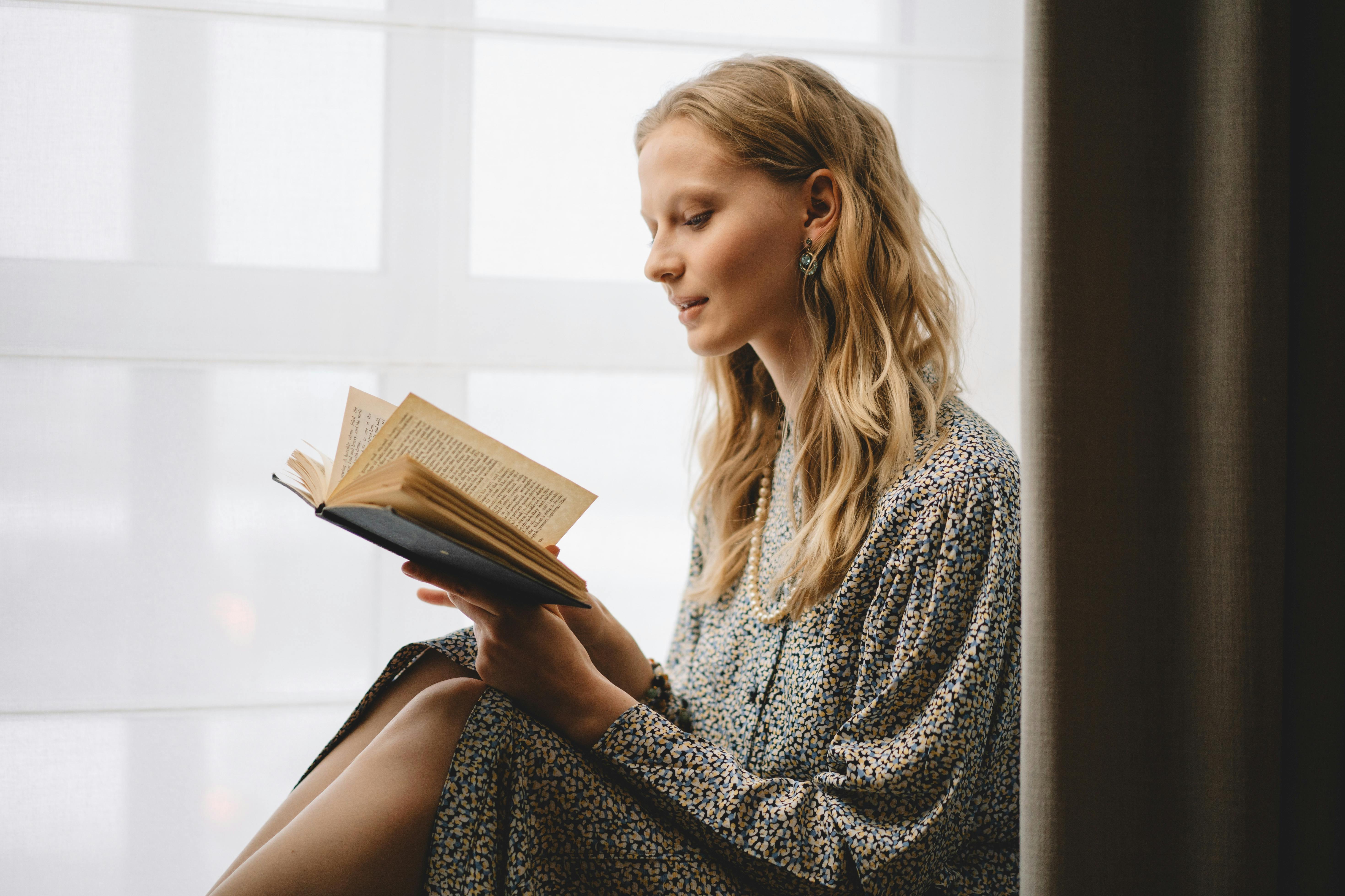 Unrecognizable Woman Reading Adoption Papers · Free Stock Photo