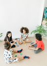 3 Women and 2 Boys Sitting on Floor
