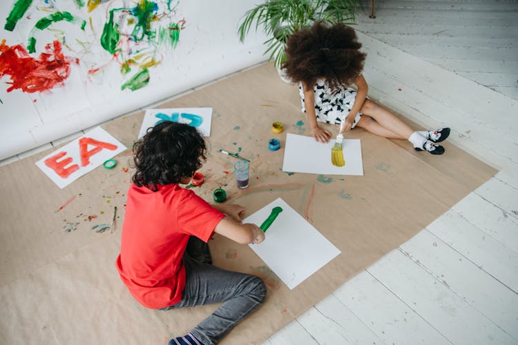 Kids Painting On White Paper