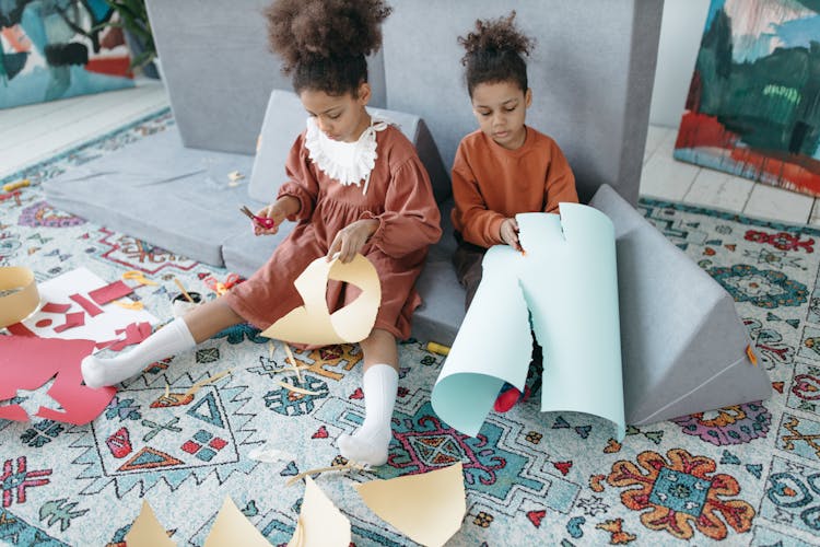 Kids Sitting On The Floor